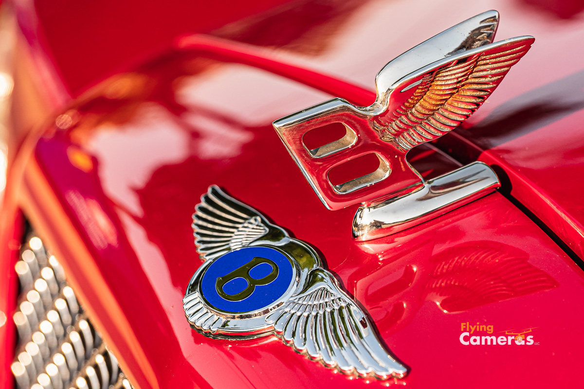 Chrome Big B and Flying B emblem on red Bentley