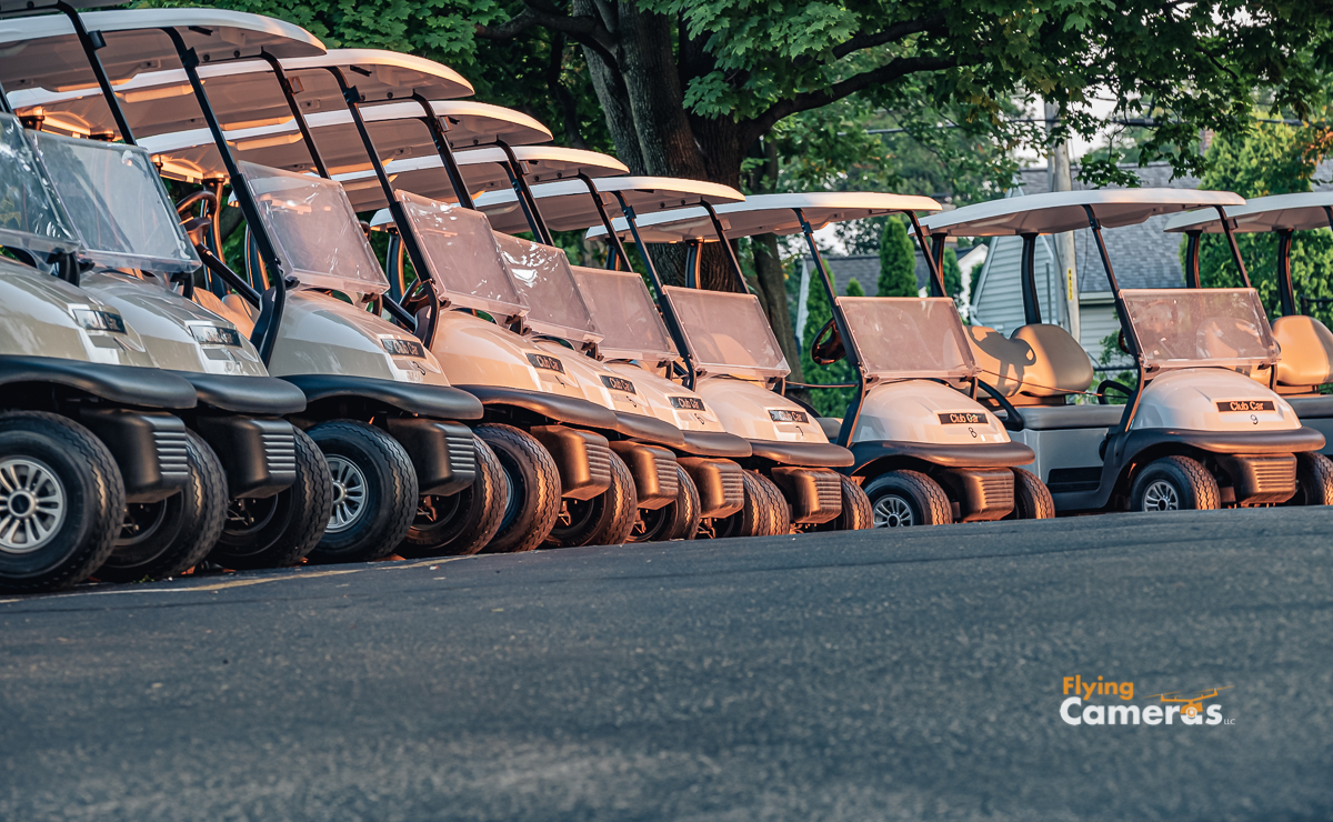 Golf carts gaze into the fading sun as they share tales of todays Downers Grove golfers