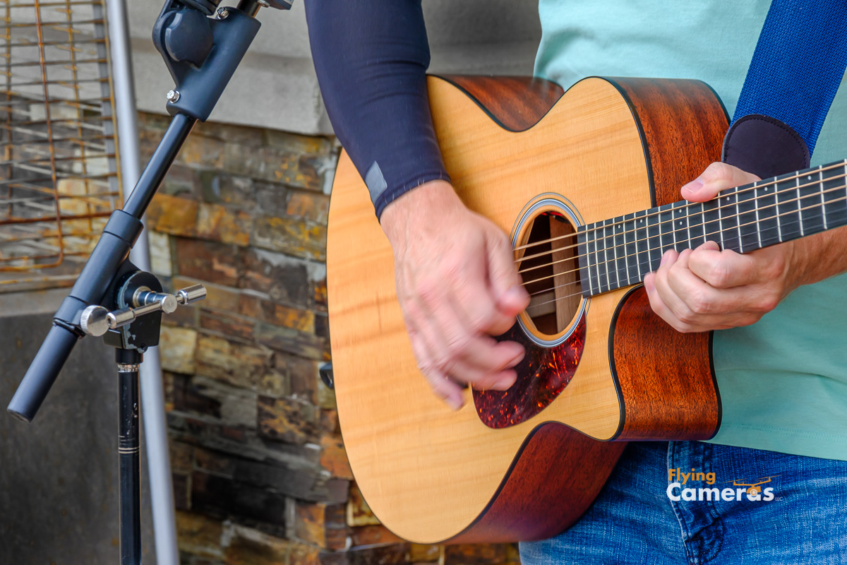 Camera captures motion of a guitarist playing his six string guitar