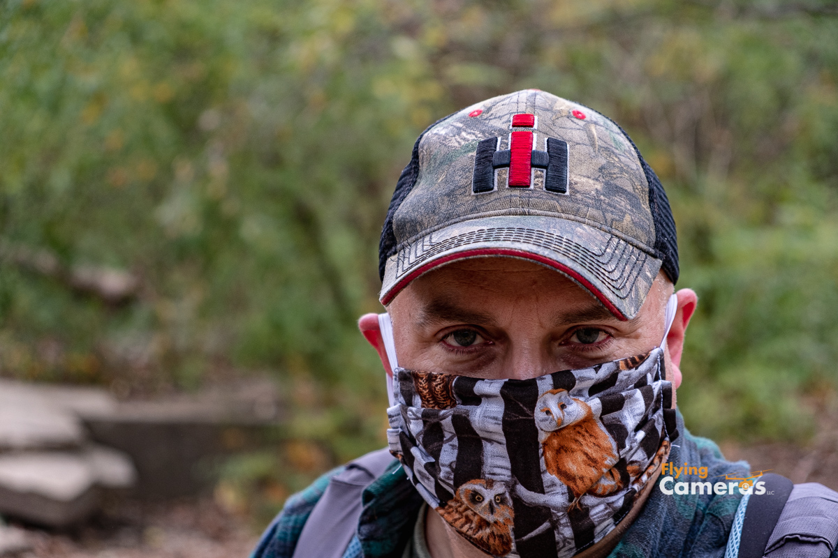 Man wearing hat and mask during covid